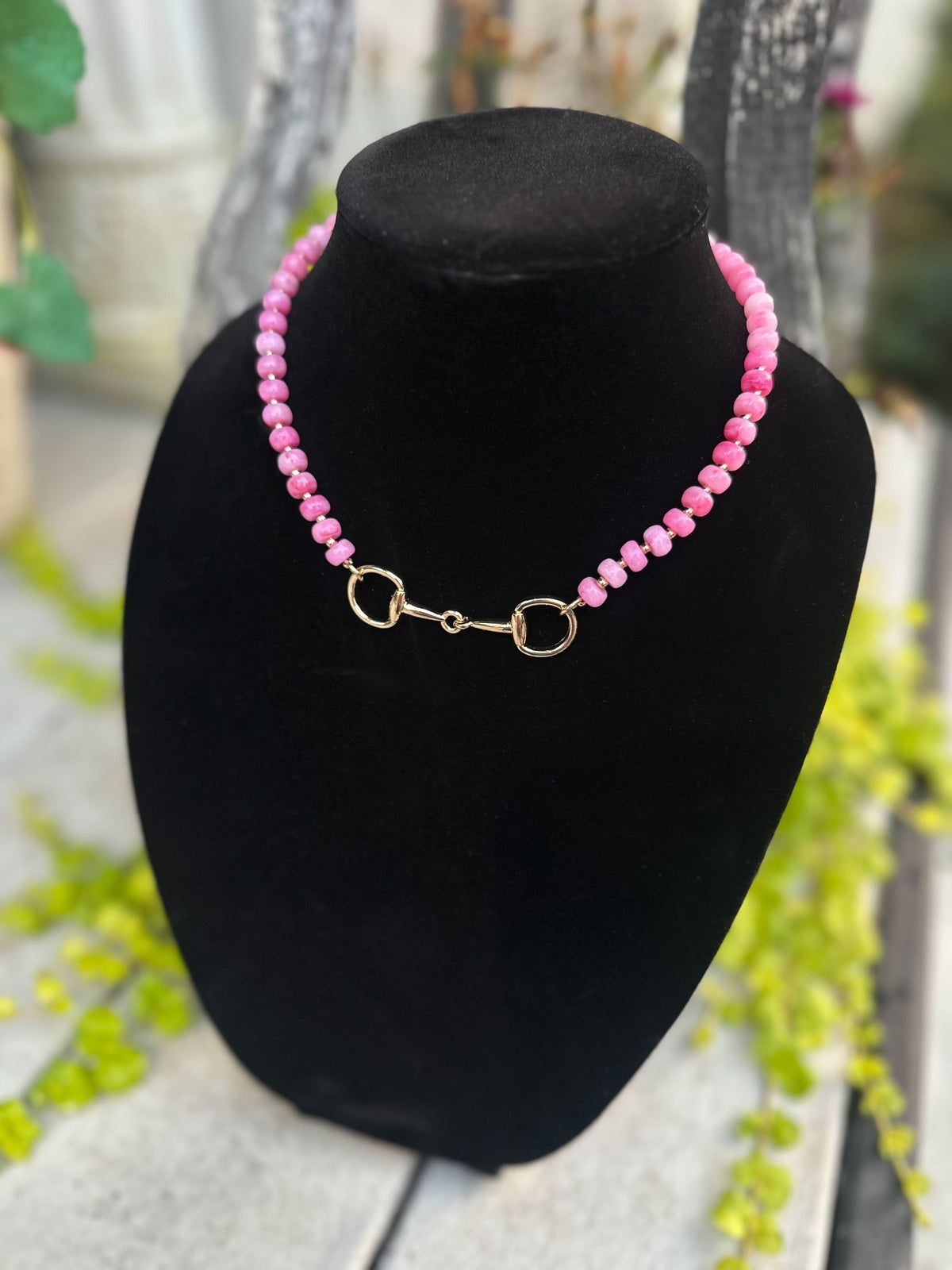 Pink beaded necklace with gold bit clasp