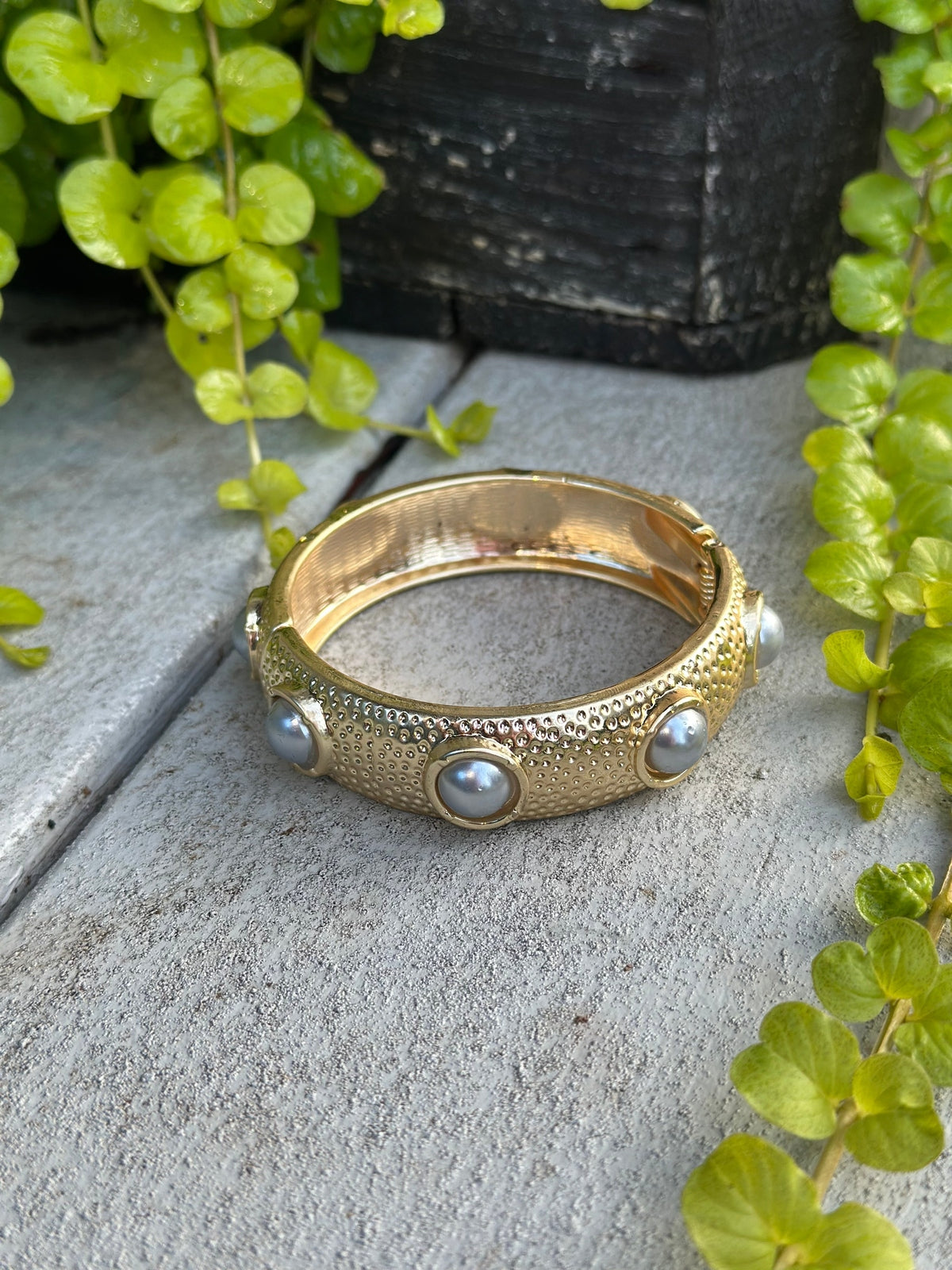 Gold, pearl bangle bracelet