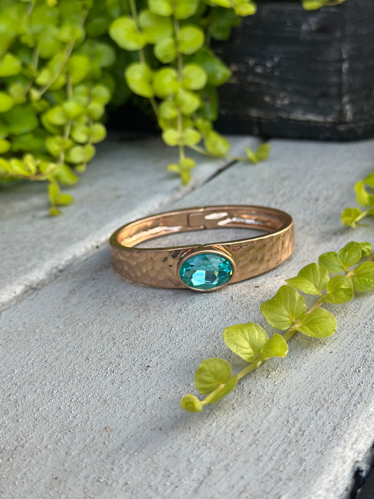 Gold hammered cuff with blue stone