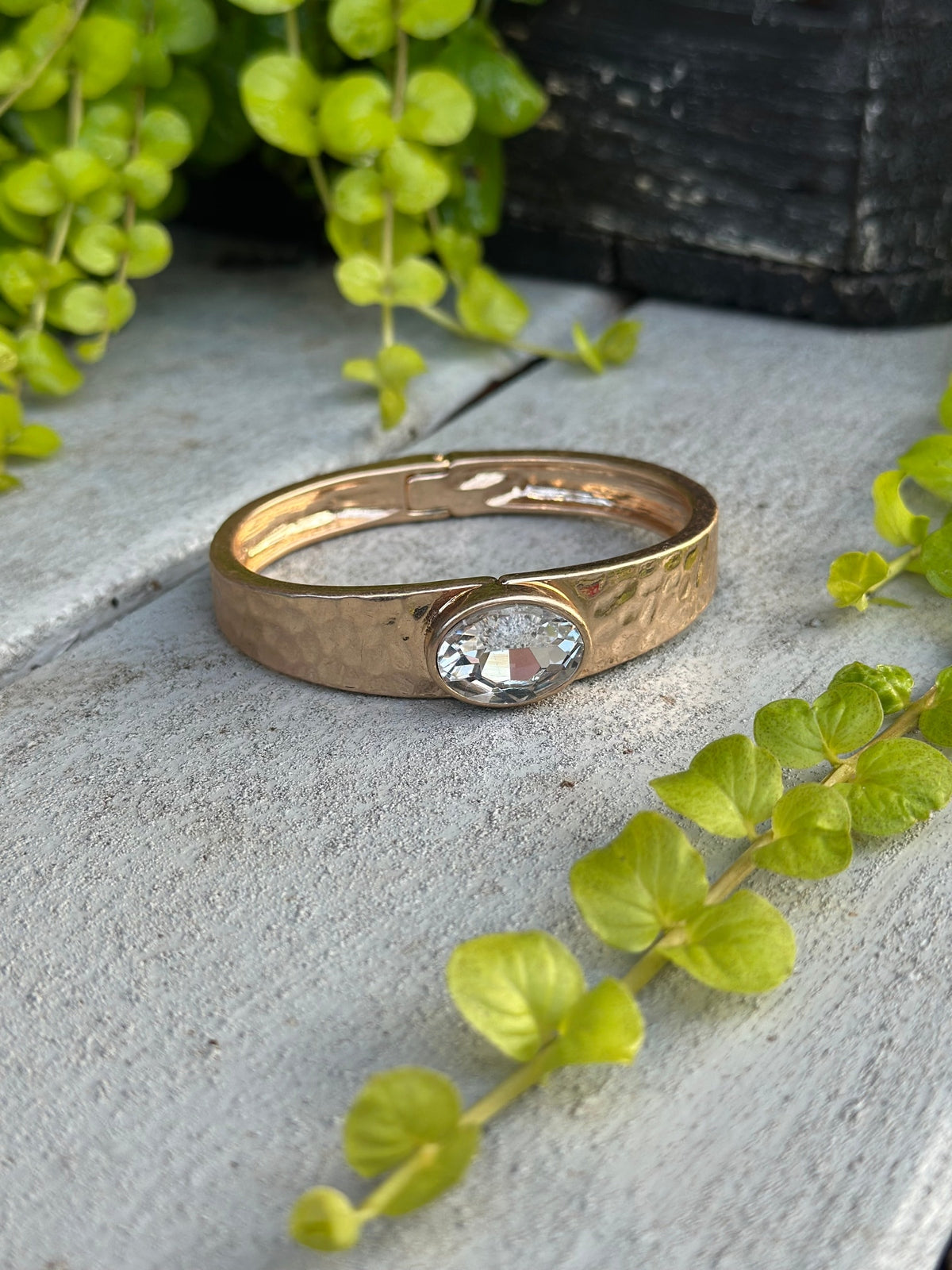 Gold hammered cuff with clear crystal stone