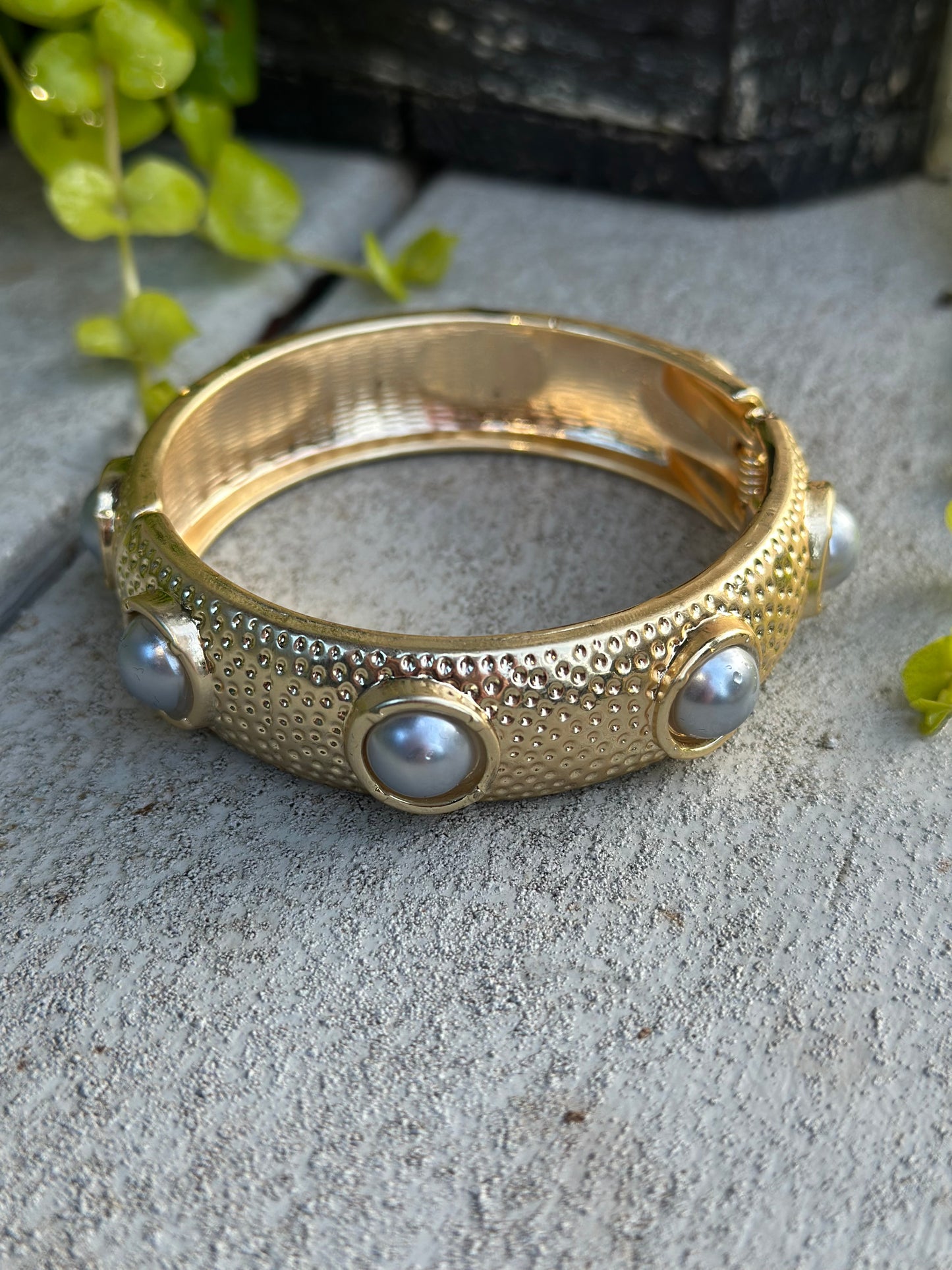 Gold, pearl bangle bracelet