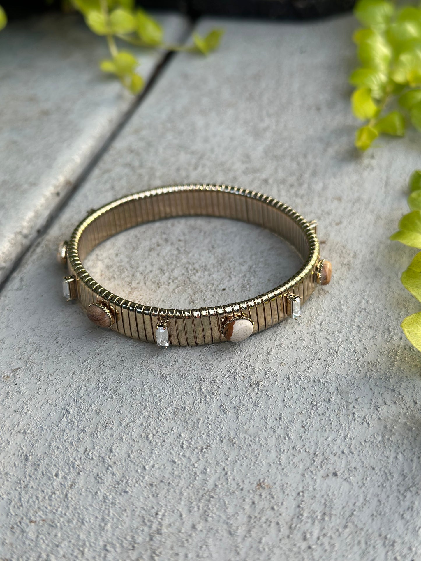 Gold ribbed stretch bracelet with stones
