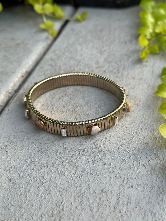 Gold ribbed stretch bracelet with stones