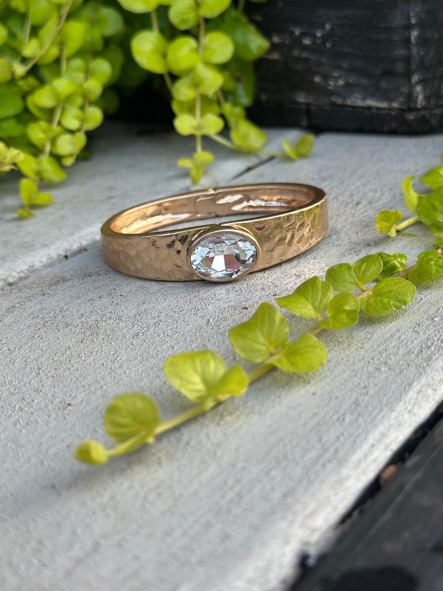 Gold hammered cuff with clear crystal stone