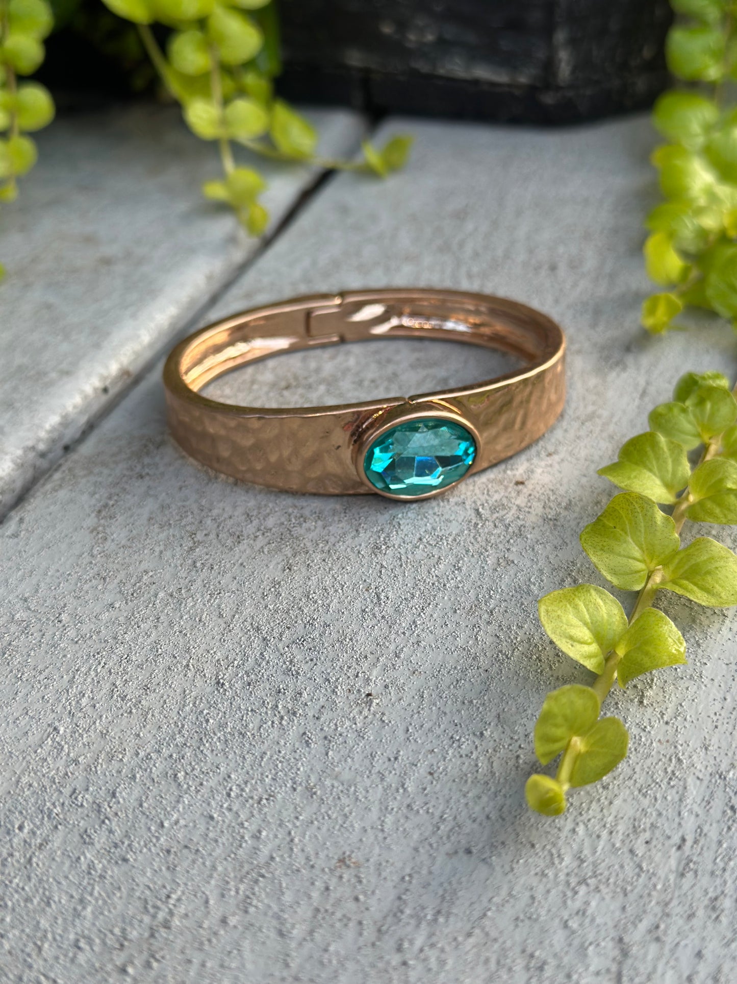 Gold hammered cuff with blue stone