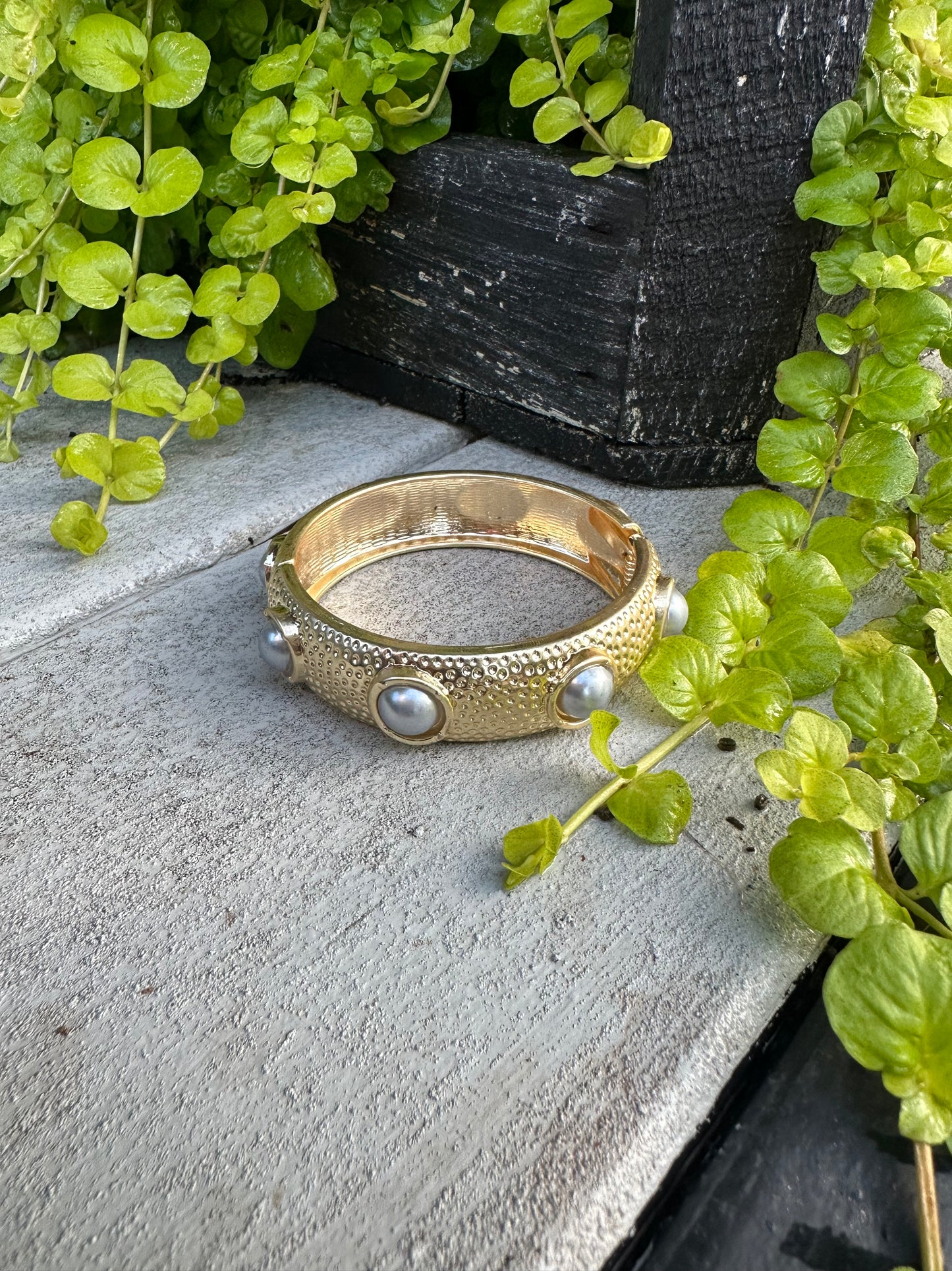 Gold, pearl bangle bracelet